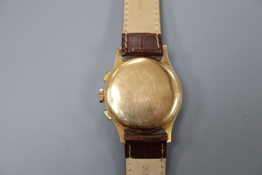 A gentlemans 1950s? 18k Suisse Chronographe manual wind wrist watch, on later associated strap.